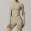 Seamless Wholesale Clothing Cropped Zip Up Workout Jacket with Thumb Holes Women's seamless apparel manufacturers