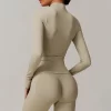 Seamless Wholesale Clothing Cropped Zip Up Workout Jacket with Thumb Holes Women's seamless apparel manufacturers
