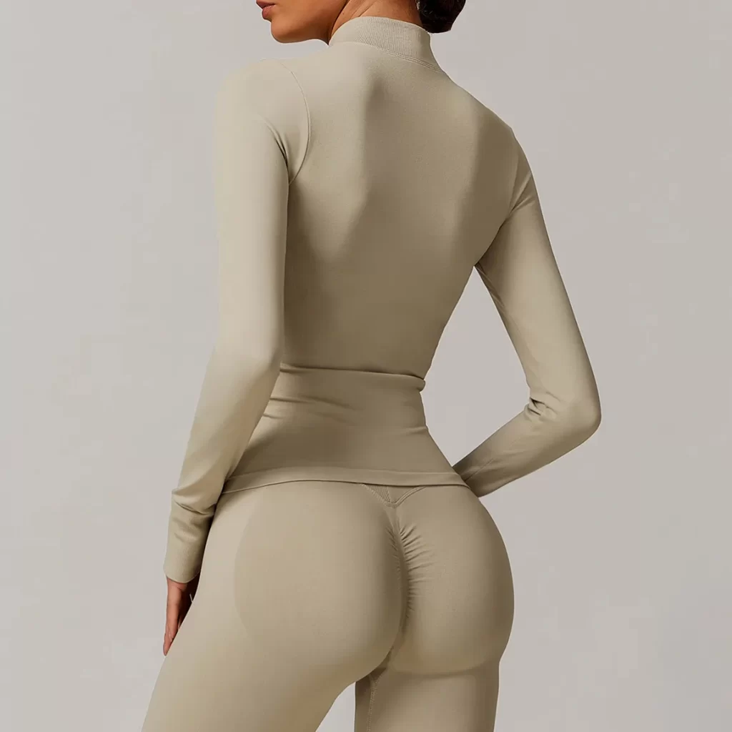 Seamless Wholesale Clothing Cropped Zip Up Workout Jacket with Thumb Holes Women's seamless apparel manufacturers
